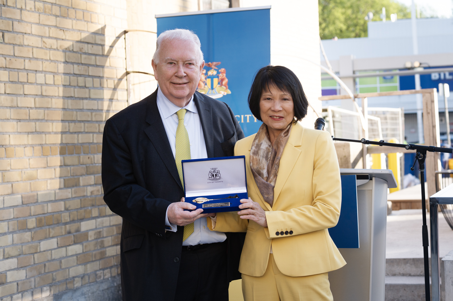 Robert Kearns and Mayor Olivia Chow holding the key to the city