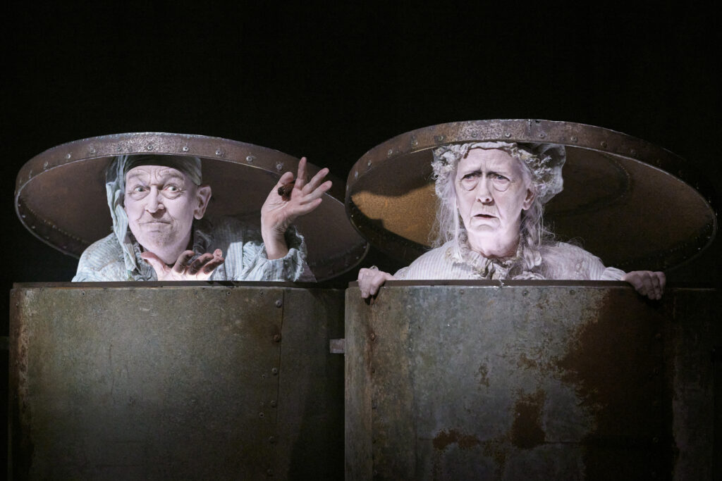 a man and a woman in garbage cans